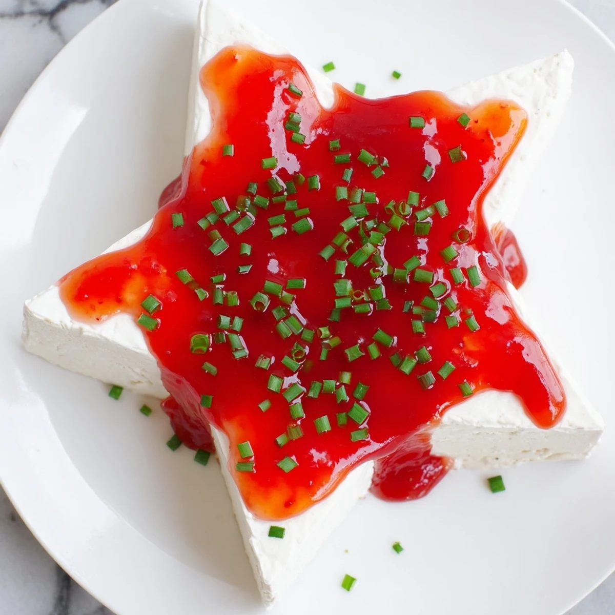 Enjoy the smooth cream cheese and sweet-spicy pepper jelly in this easy Cream Cheese and Pepper Jelly Star.
