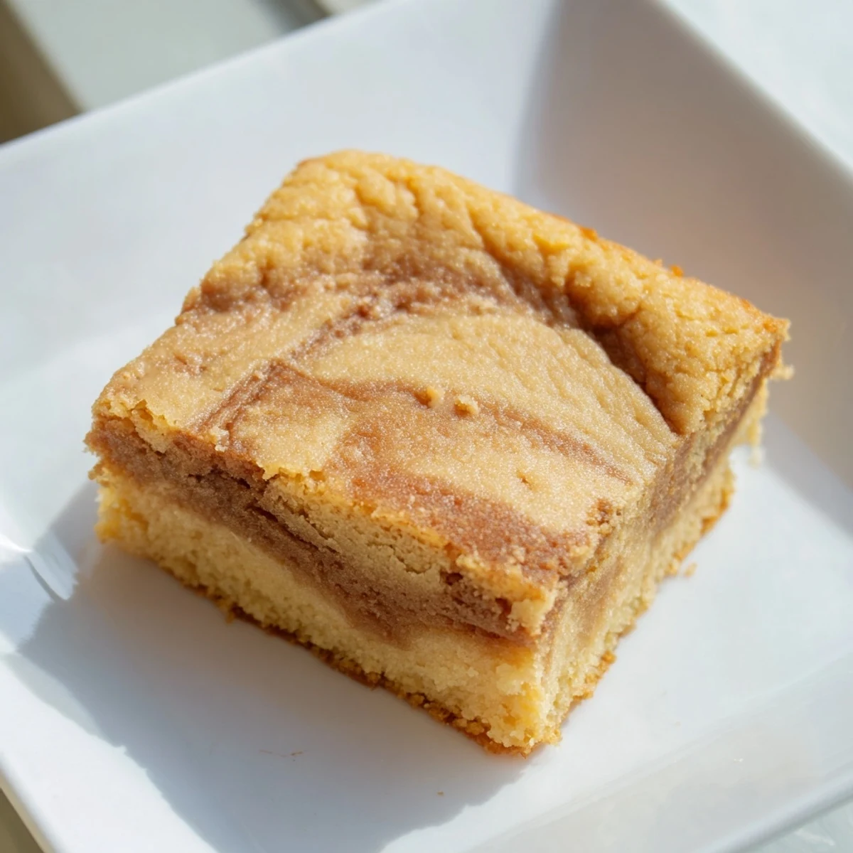 Golden brown Peanut Butter Mochi Cake, a dessert that offers irresistible chewy textures with a peanut butter aroma.