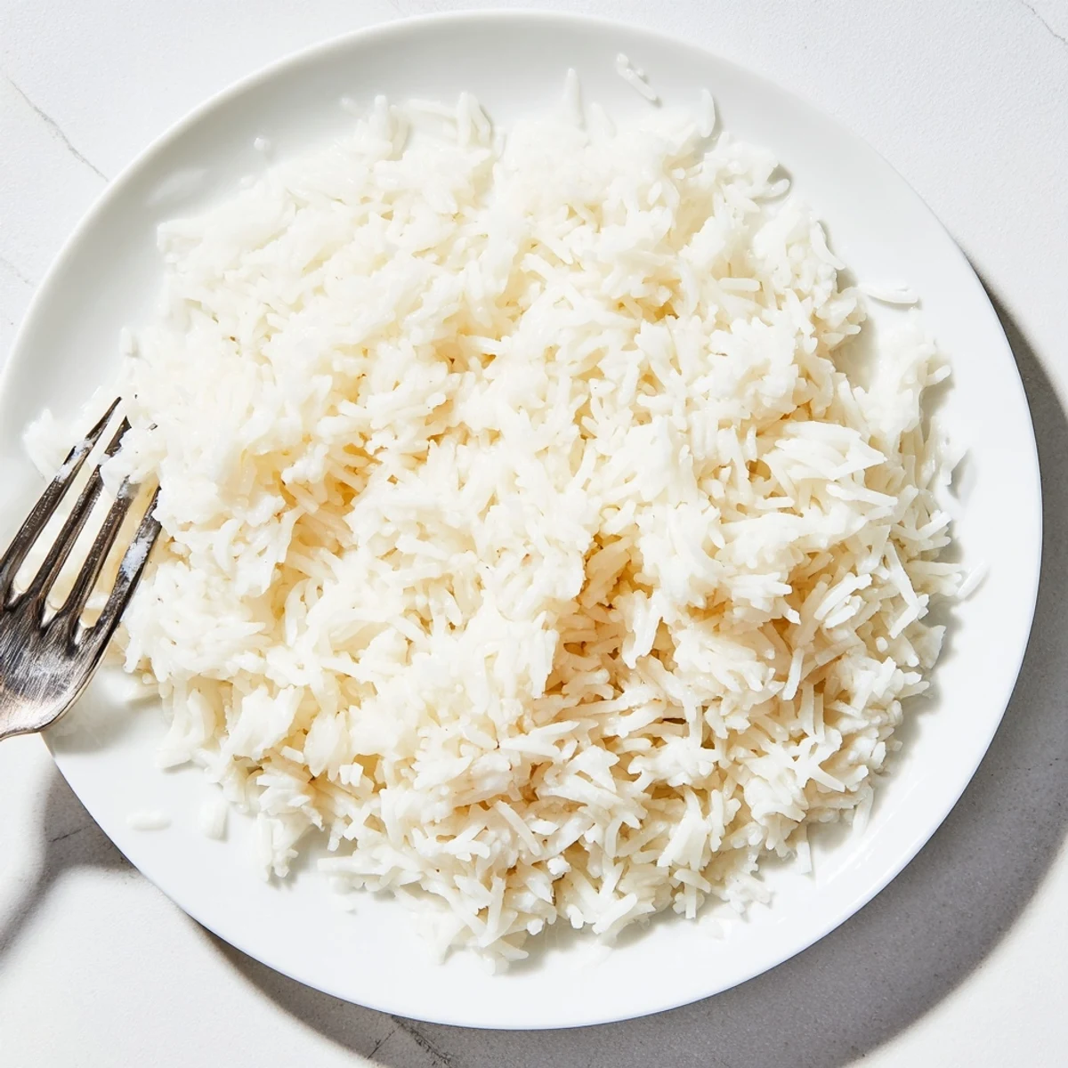 Fluffy Coconut Jasmine Rice, a creamy side dish, ready to be paired with vibrant curries.