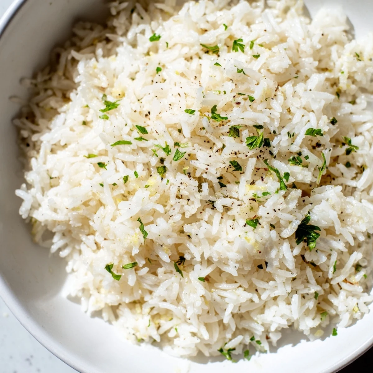Enjoy a close-up of buttery, golden Garlic Butter Rice, ready to be paired with your favorite entree.