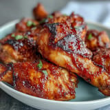 Mouthwatering BBQ chicken drumsticks brushed generously with sweet, spicy peach glaze.