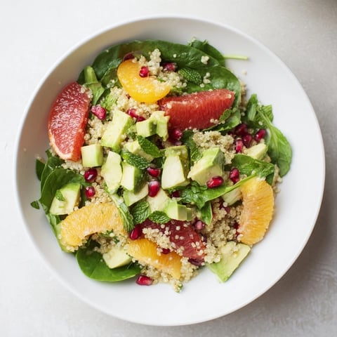 Bright, fresh Fresh Citrus & Avocado Quinoa Bowl, with vibrant orange, grapefruit, and creamy avocado.