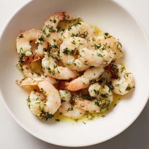 Light & Bright Lemon Herb Shrimp Scampi, garnished with fresh herbs and lemon wedges, ready to enjoy.