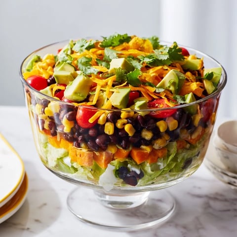 Southwest Sunset Palette salad features vibrant layers of yellow peppers and spicy red chili cheese.