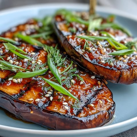 Miso Glazed Eggplant with caramelized edges and sesame seeds, a savory Japanese side dish.