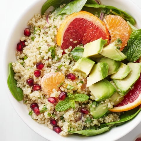 A colorful photo of a Fresh Citrus & Avocado Quinoa Bowl, ready to refresh your taste buds.