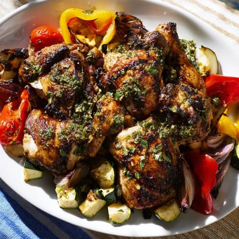 A delicious sheet pan of Basil-Soft Chicken and Veggie Dinner, featuring golden-brown chicken and colorful vegetables.