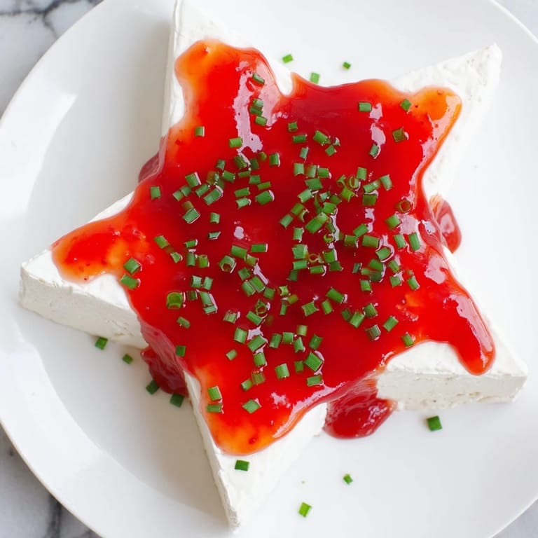 Enjoy the smooth cream cheese and sweet-spicy pepper jelly in this easy Cream Cheese and Pepper Jelly Star.