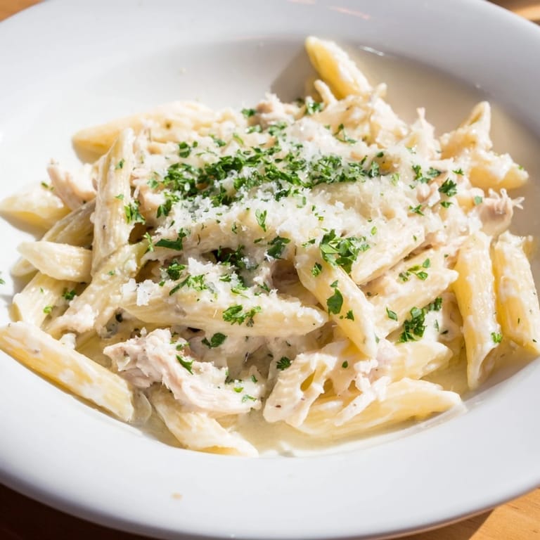 Delicious, creamy Tinis Chicken Pasta with tender chicken and perfectly cooked penne in a rich sauce.