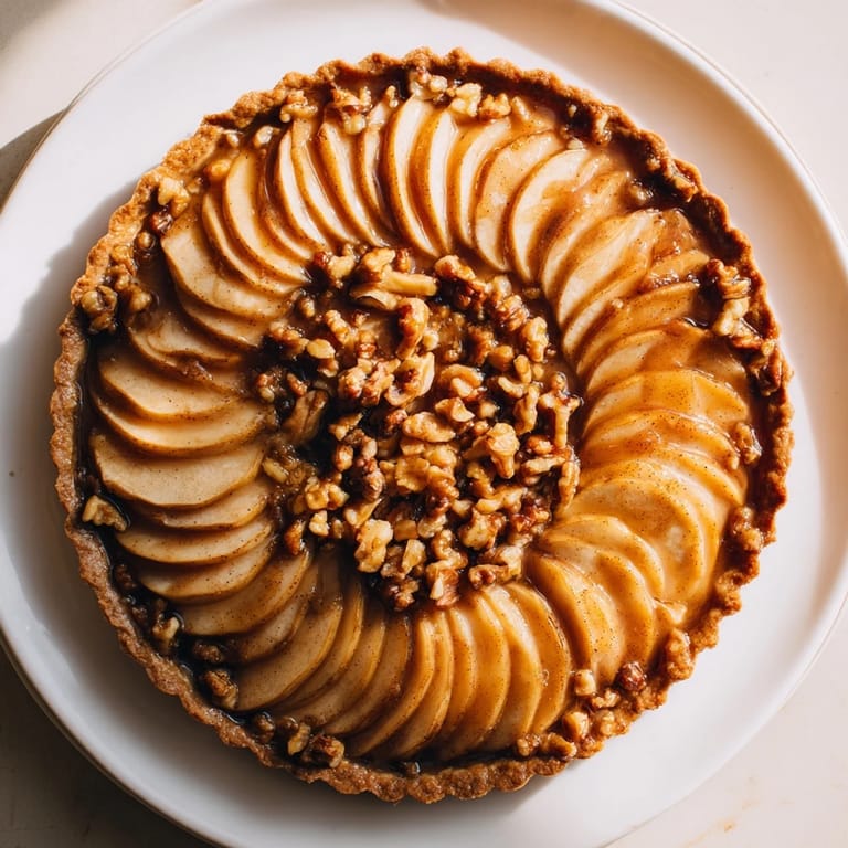 This Lattice Orchard pie features a delicate apple lattice, ready to enjoy with a scoop of vanilla ice cream.