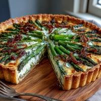 Spring Asparagus Quiche with golden caramelized shallots and creamy Gruyère cheese in a flaky crust, perfect for elegant brunch entertaining.